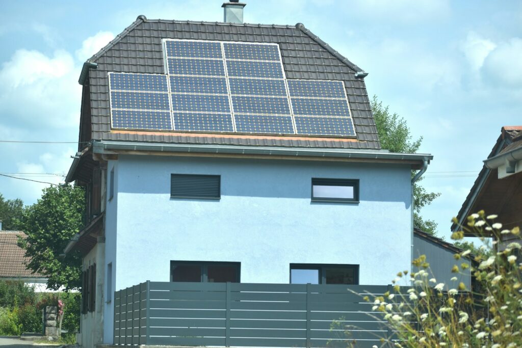 A house with a solar panel on the roof