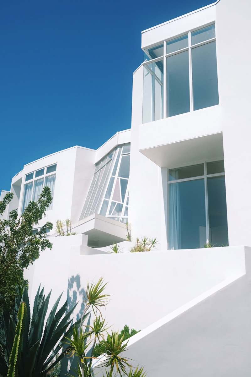 a tall white building with lots of windows