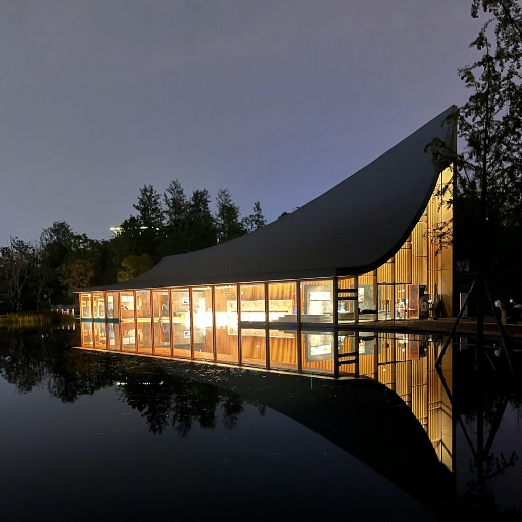 a building with a lake in the background